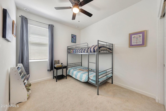 bedroom with carpet floors, baseboards, and ceiling fan