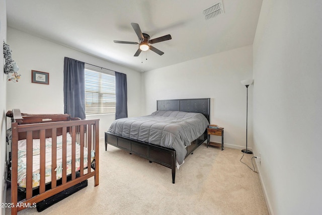 bedroom with visible vents, carpet flooring, baseboards, and ceiling fan