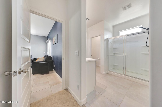 full bathroom featuring visible vents, tile patterned floors, baseboards, and a stall shower
