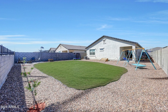 view of yard with a patio, a fenced backyard, a playground, and cooling unit
