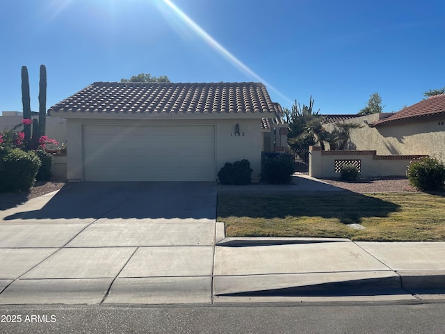 1382 N Tamarisk Dr, Chandler, AZ 85224 - view of front of home featuring concrete driveway, an attached garage, stucco siding, and a tile roof