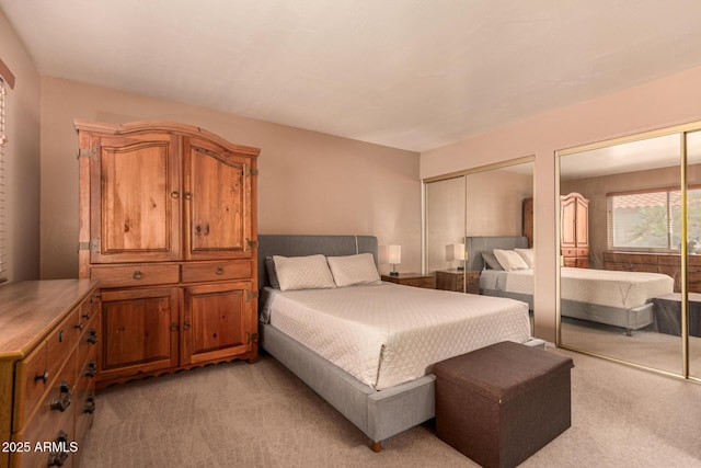 1382 N Tamarisk Dr, Chandler, AZ 85224 - bedroom featuring light carpet and multiple closets