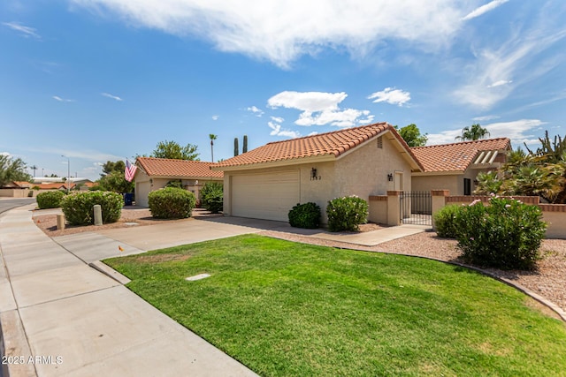 1382 N Tamarisk Dr, Chandler, AZ 85224 - mediterranean / spanish home featuring stucco siding, a tile roof, a garage, concrete driveway, and a gate