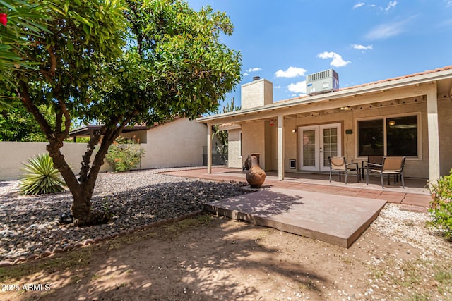 1382 N Tamarisk Dr, Chandler, AZ 85224 - rear view of house with french doors, a chimney, a patio area, and stucco siding