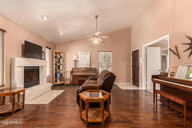 1382 N Tamarisk Dr, Chandler, AZ 85224 - living area with lofted ceiling, a ceiling fan, a fireplace, and dark wood-style flooring