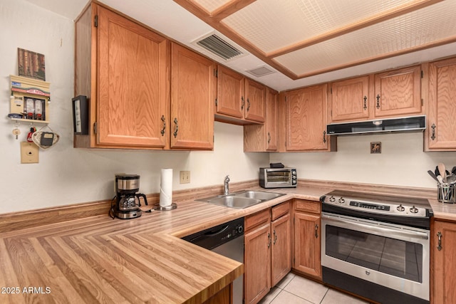 1382 N Tamarisk Dr, Chandler, AZ 85224 - kitchen with stainless steel appliances, under cabinet range hood, light countertops, and brown cabinets