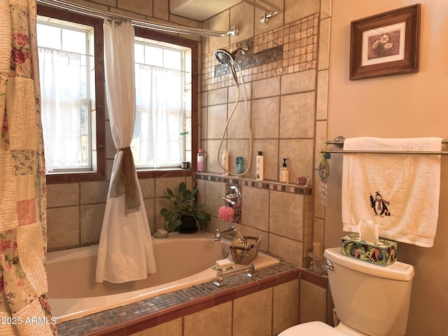 bathroom featuring shower / bath combo, toilet, and a healthy amount of sunlight