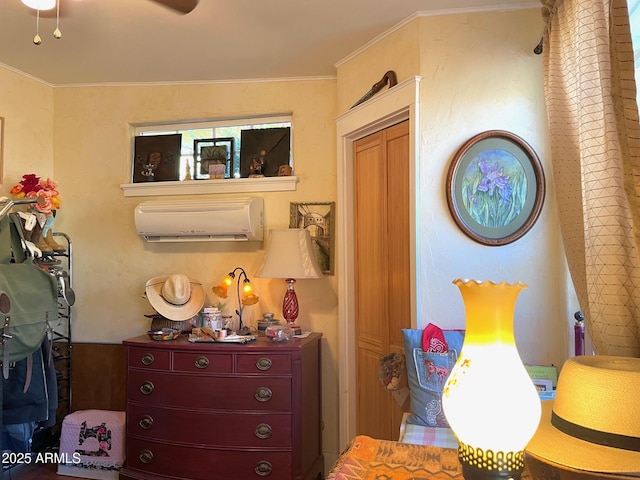 bedroom with a wall mounted AC and crown molding