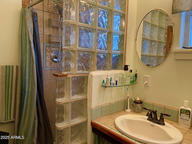 bathroom with vanity and walk in shower