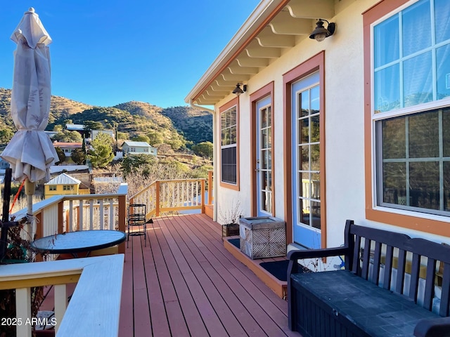 wooden terrace featuring a mountain view