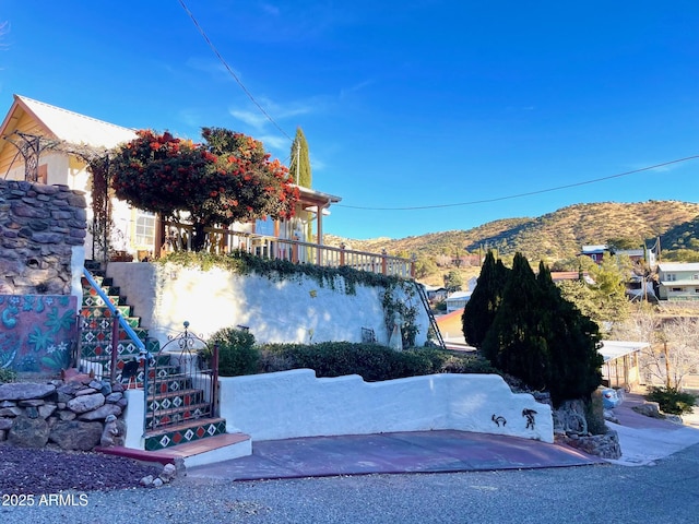 view of side of home featuring a mountain view