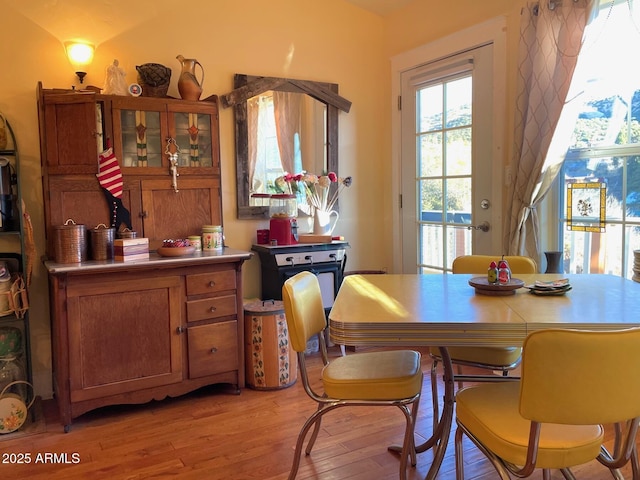 dining area with light hardwood / wood-style floors