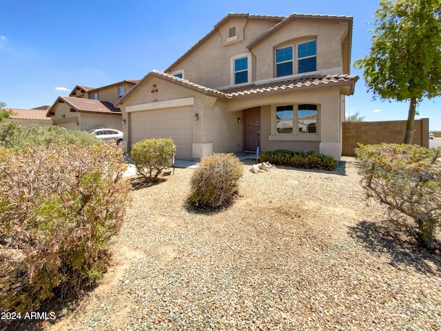 view of front of property with a garage