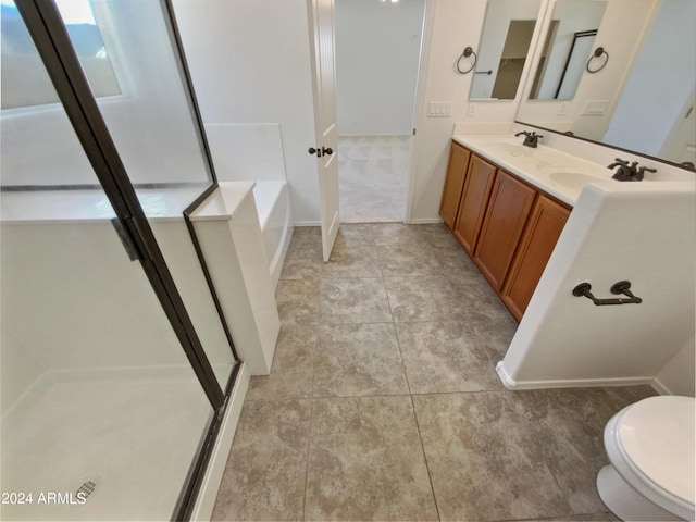 bathroom with independent shower and bath, vanity, and tile patterned floors