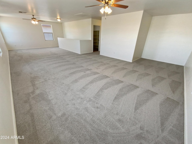 spare room with light carpet and ceiling fan