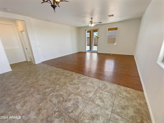 empty room featuring ceiling fan and light wood-type flooring