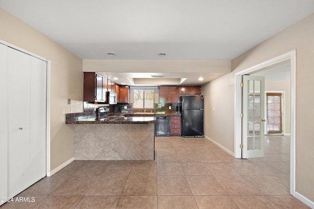 kitchen with sink, black appliances, light tile patterned flooring, and kitchen peninsula