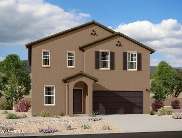 view of front of home featuring an attached garage, a tiled roof, concrete driveway, and stucco siding