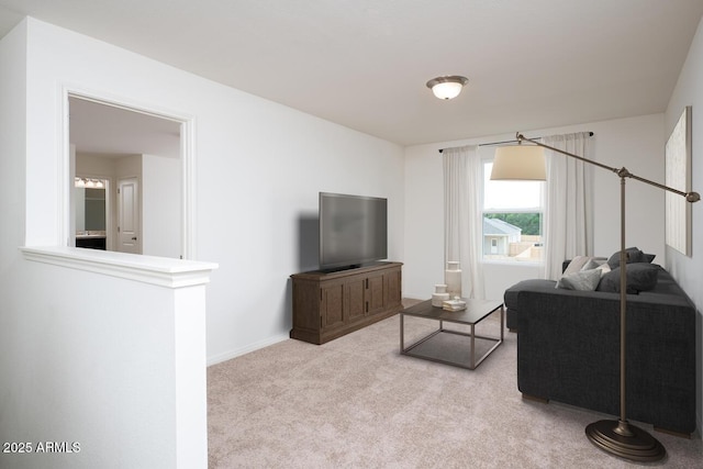 living area featuring light colored carpet