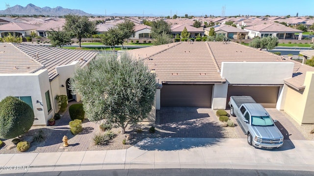 birds eye view of property featuring a mountain view