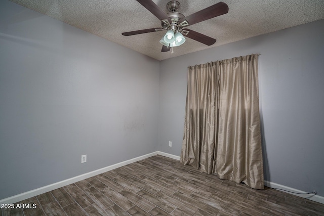 5813 N 39th Ave, Phoenix, AZ 85019 - spare room featuring dark wood-style flooring, a textured ceiling, baseboards, and a ceiling fan