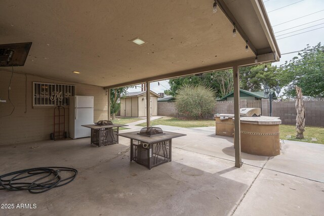 5813 N 39th Ave, Phoenix, AZ 85019 - fenced backyard featuring an outdoor fire pit and a patio area