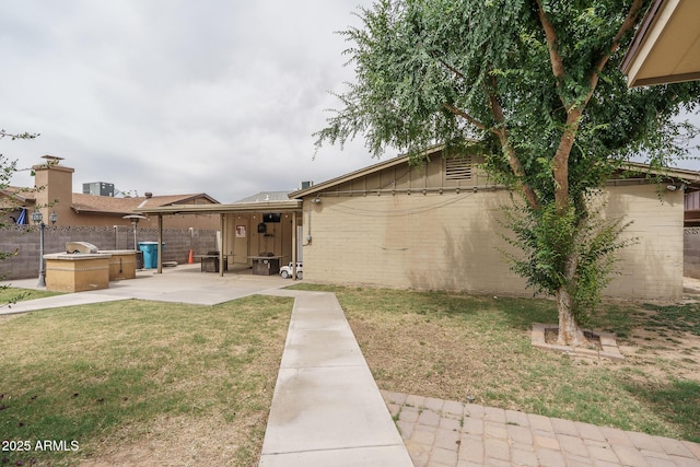 5813 N 39th Ave, Phoenix, AZ 85019 - view of yard featuring a patio area and exterior kitchen