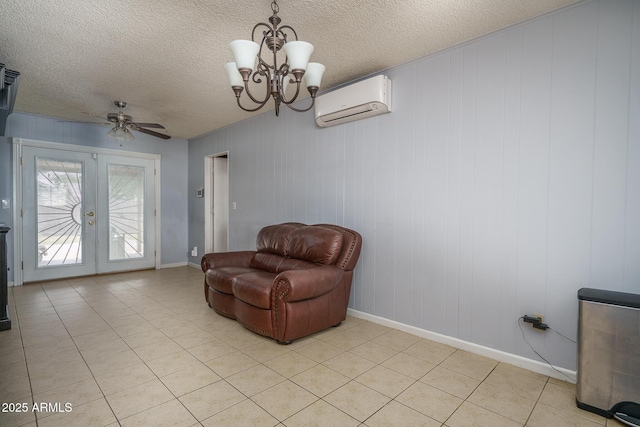 5813 N 39th Ave, Phoenix, AZ 85019 - sitting room with a wall mounted air conditioner, french doors, a textured ceiling, light tile patterned flooring, and a chandelier