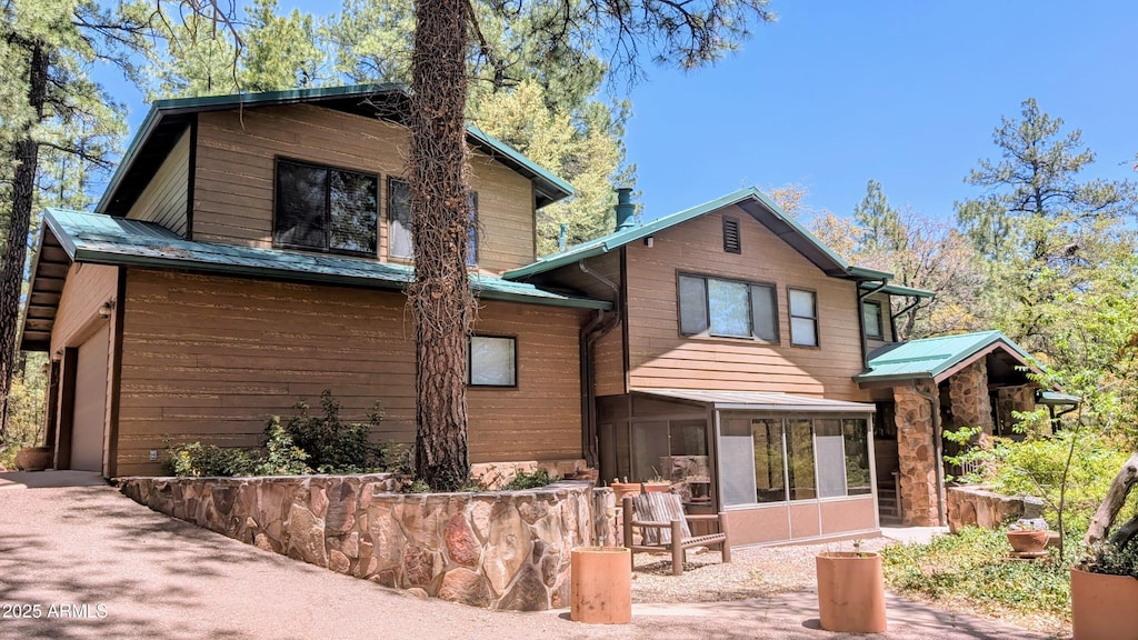 167 E Belluzzi Blvd, Payson, AZ 85541 - rear view of house featuring a sunroom and metal roof