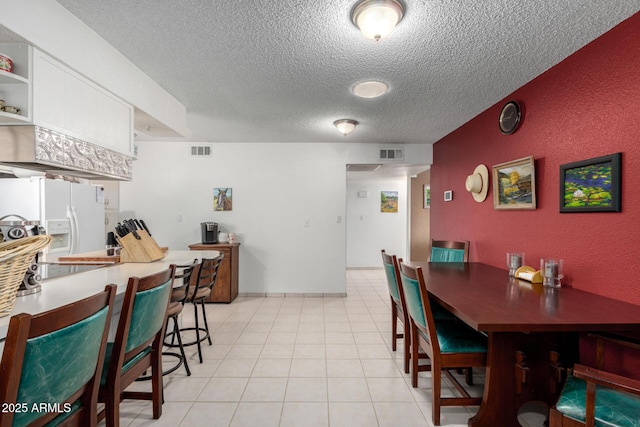 dining room featuring a textured ceiling