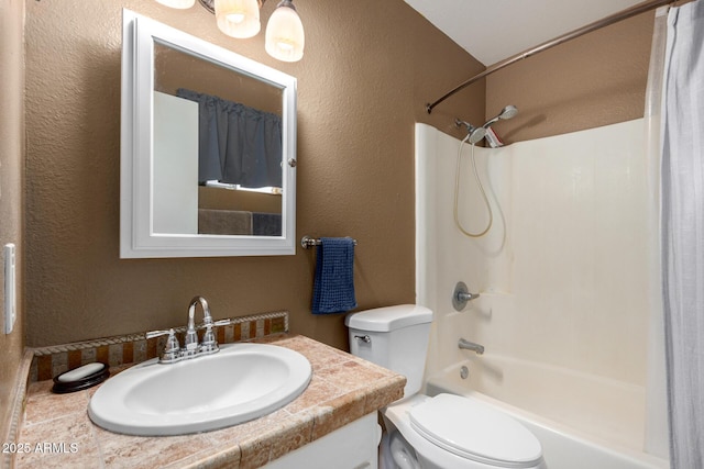 full bathroom featuring bathing tub / shower combination, vanity, and toilet