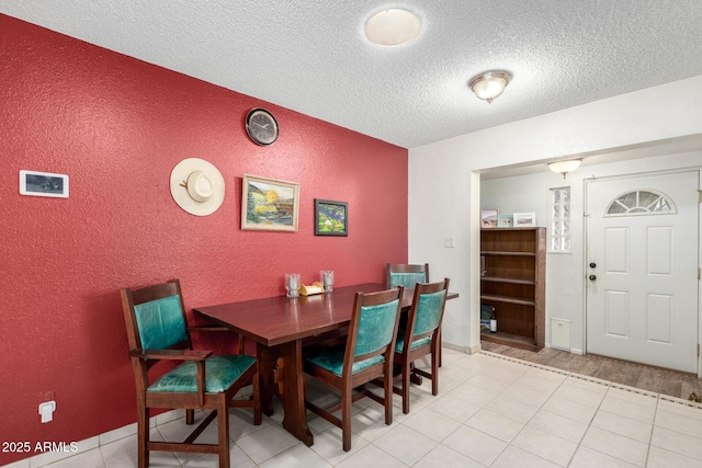 dining room with a textured ceiling