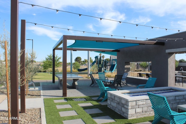 view of patio featuring a fire pit