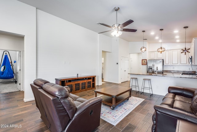 4218 W Palace Station Rd, New River, AZ 85087 - living area with a ceiling fan and dark wood-style flooring