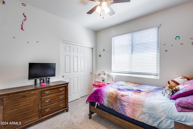 4218 W Palace Station Rd, New River, AZ 85087 - bedroom featuring light carpet, a closet, and a ceiling fan