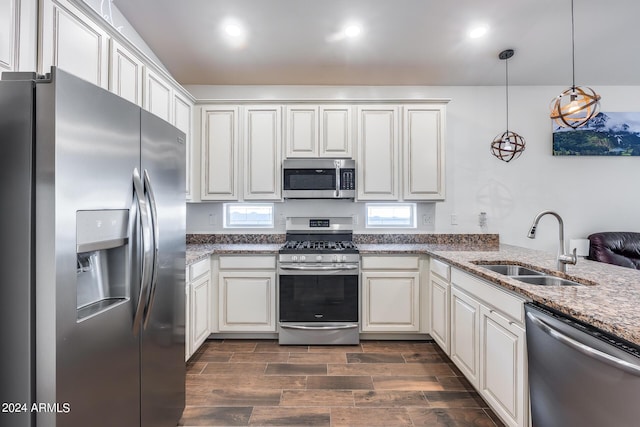 4218 W Palace Station Rd, New River, AZ 85087 - kitchen with stainless steel appliances, a sink, dark wood finished floors, light stone counters, and recessed lighting