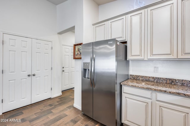 4218 W Palace Station Rd, New River, AZ 85087 - kitchen with stainless steel fridge, dark wood-style floors, and stone countertops