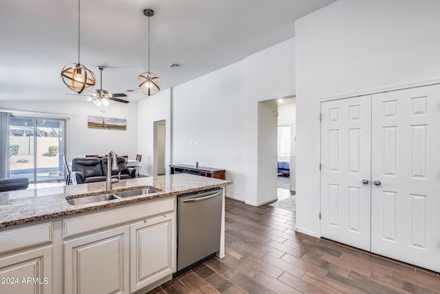 4218 W Palace Station Rd, New River, AZ 85087 - kitchen featuring stainless steel dishwasher, a sink, open floor plan, and light stone counters