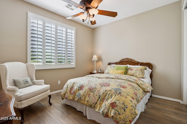 bedroom featuring ceiling fan and dark hardwood / wood-style flooring