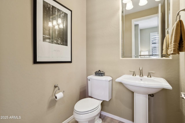 bathroom featuring sink and toilet