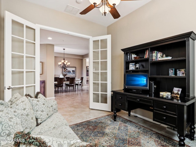 living room featuring ceiling fan with notable chandelier, tile patterned floors, and french doors