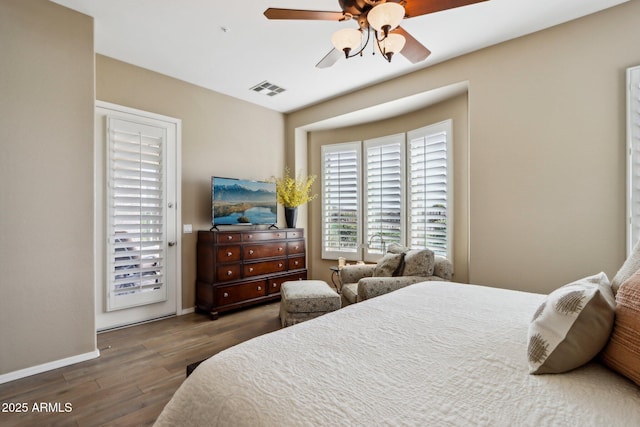 bedroom featuring ceiling fan and dark hardwood / wood-style flooring