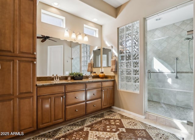 bathroom with an enclosed shower, vanity, tile patterned floors, and ceiling fan