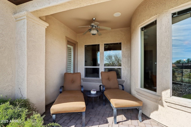 view of patio featuring ceiling fan