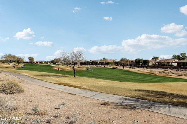 surrounding community featuring a lawn