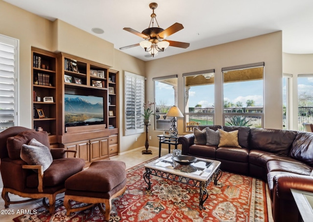 living room with light tile patterned floors and ceiling fan