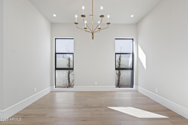8503 S 9th Dr Unit 17, Phoenix, AZ 85041 - spare room with a chandelier, light wood-style flooring, baseboards, and recessed lighting