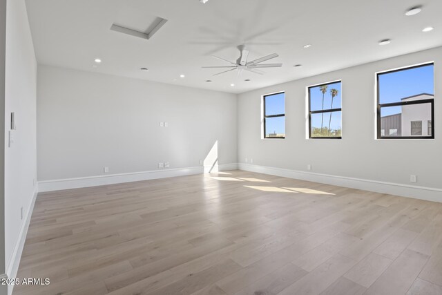 8503 S 9th Dr Unit 17, Phoenix, AZ 85041 - empty room with attic access, light wood-style floors, baseboards, and recessed lighting