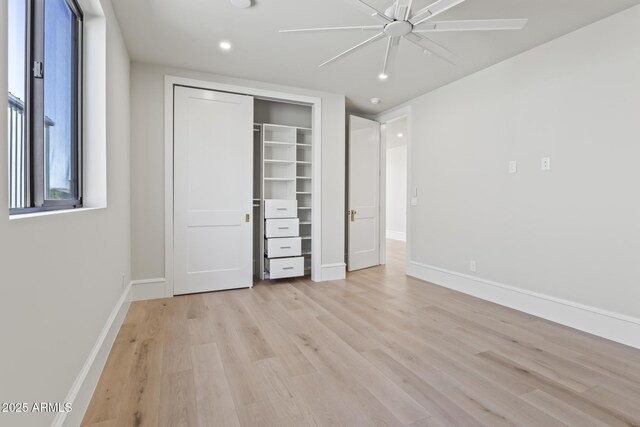8503 S 9th Dr Unit 17, Phoenix, AZ 85041 - unfurnished bedroom with light wood finished floors, baseboards, a closet, recessed lighting, and a ceiling fan