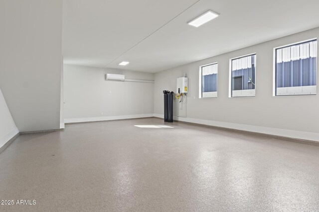 8503 S 9th Dr Unit 17, Phoenix, AZ 85041 - below grade area featuring tankless water heater, a wall mounted AC, and baseboards